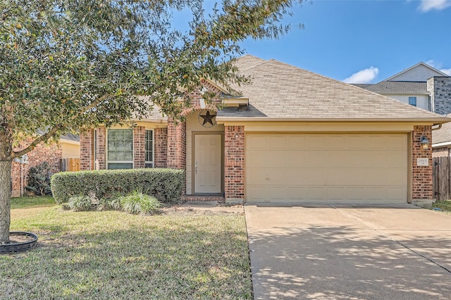 view of front of property with a garage and a front lawn