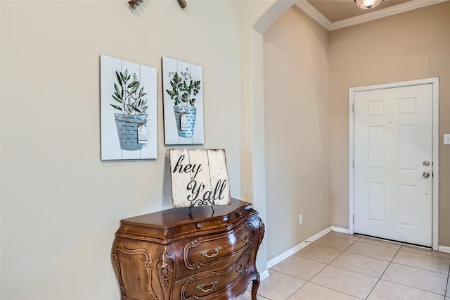 tiled entrance foyer with ornamental molding