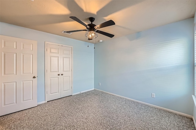 unfurnished bedroom featuring a closet, ceiling fan, and carpet