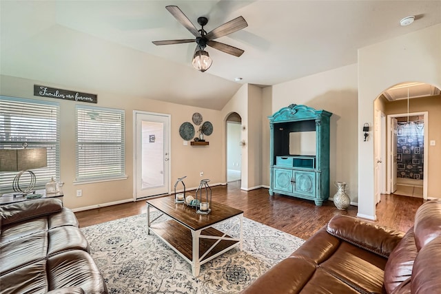 living room featuring ceiling fan, lofted ceiling, and dark hardwood / wood-style floors