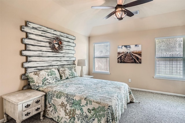 bedroom with ceiling fan, carpet flooring, and vaulted ceiling