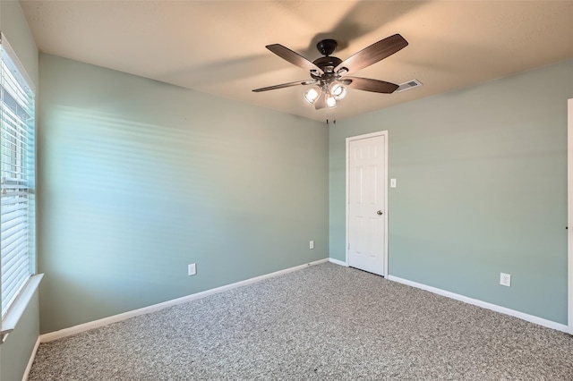 empty room with carpet floors and ceiling fan