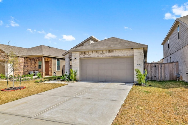 view of front of property featuring a garage and a front yard