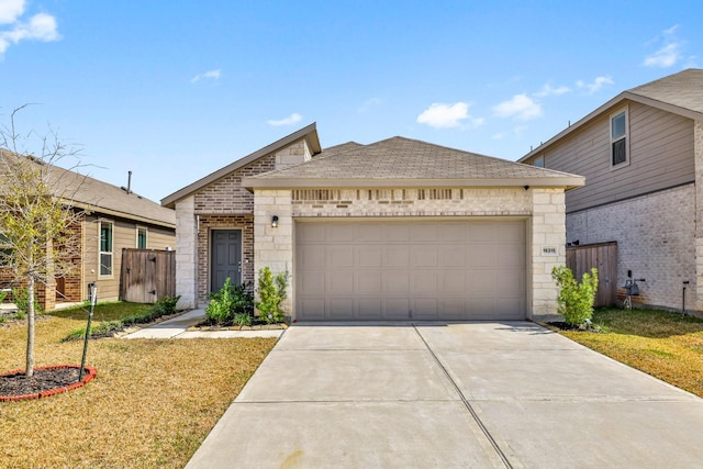 view of front facade with a garage and a front lawn