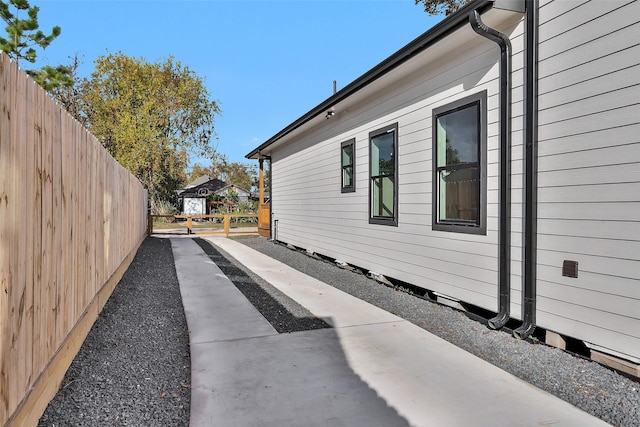 view of side of property with a patio