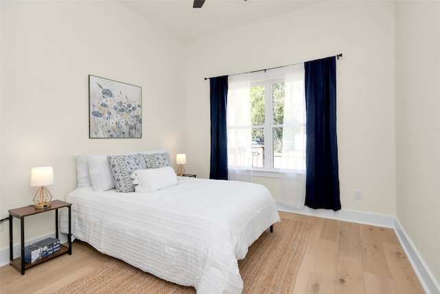 bedroom with hardwood / wood-style floors and ceiling fan