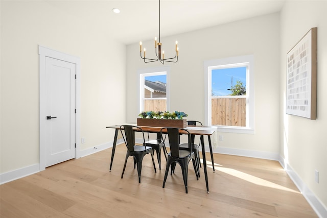 dining room featuring a chandelier and light hardwood / wood-style floors