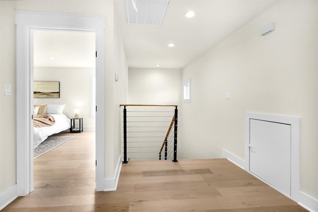 hall with light hardwood / wood-style floors