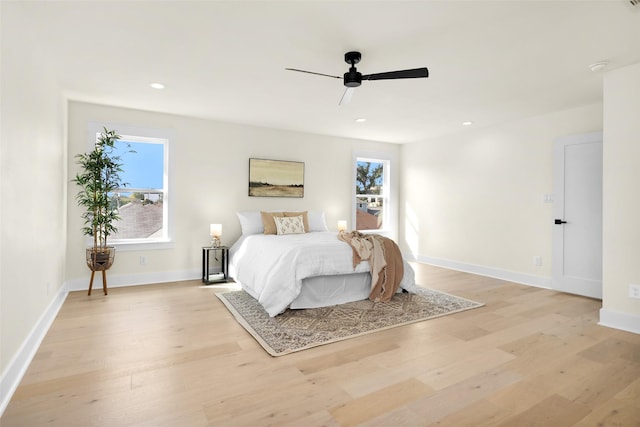 bedroom featuring light hardwood / wood-style flooring and ceiling fan