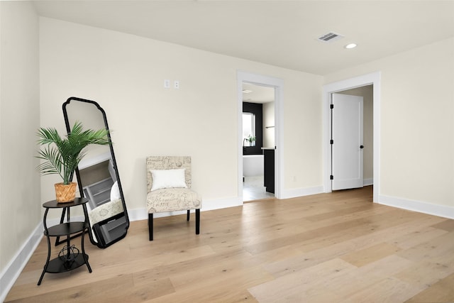 living area with light hardwood / wood-style floors