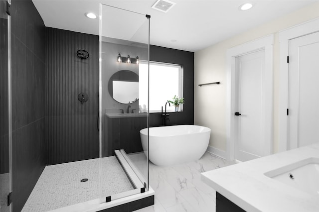 bathroom featuring vanity and shower with separate bathtub