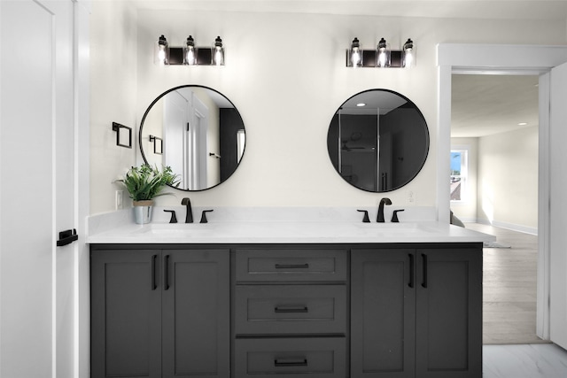 bathroom with vanity and wood-type flooring