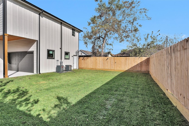 view of yard with central air condition unit