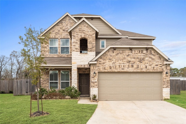 craftsman inspired home with a garage and a front lawn