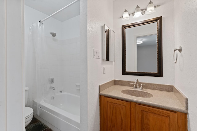 full bathroom with vanity, shower / bath combo, and toilet