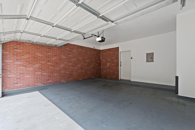 garage featuring a garage door opener and electric panel