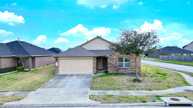 view of front of property featuring a garage and a front yard