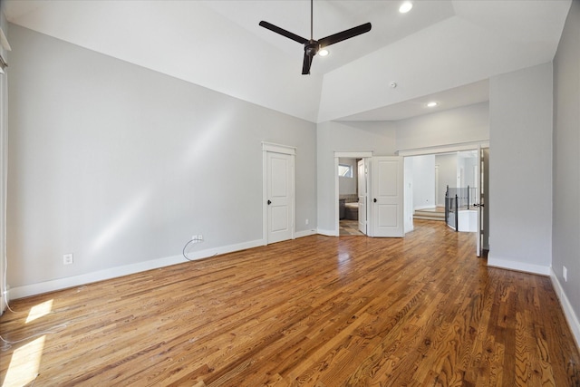 interior space featuring hardwood / wood-style flooring, ceiling fan, and high vaulted ceiling