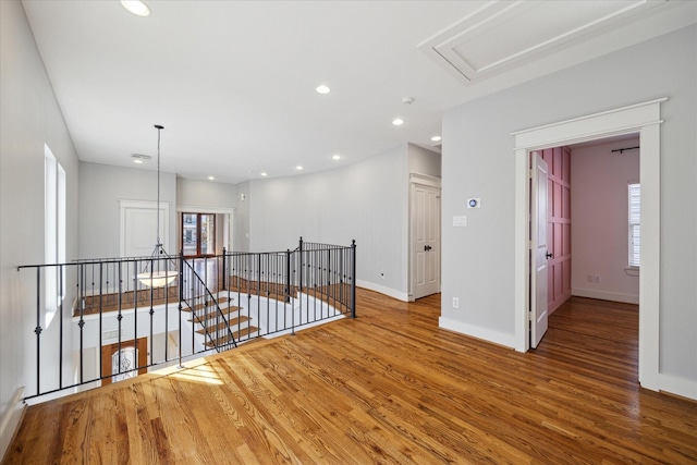 hall with hardwood / wood-style floors