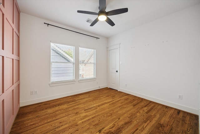 unfurnished room with hardwood / wood-style floors and ceiling fan