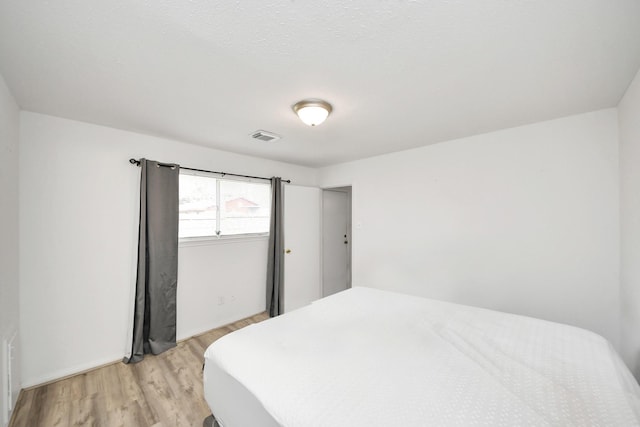 bedroom featuring light hardwood / wood-style floors