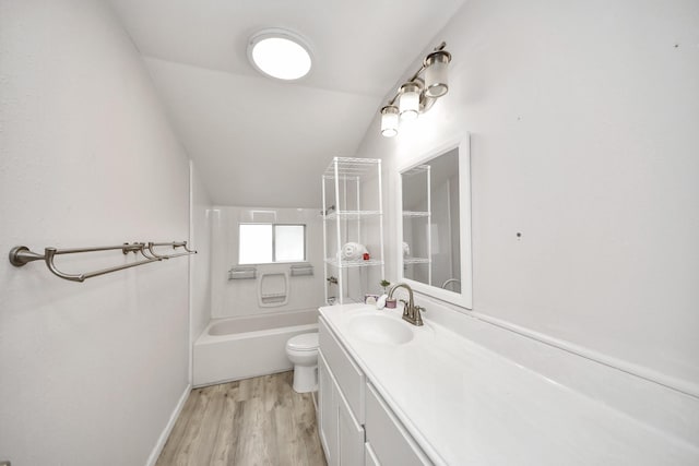 full bathroom with toilet, bathing tub / shower combination, vaulted ceiling, vanity, and hardwood / wood-style floors