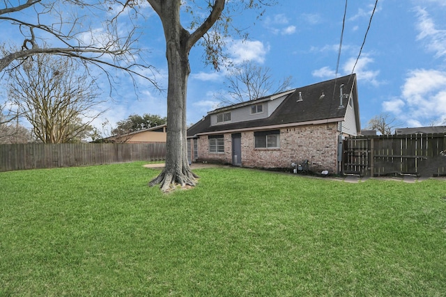 2008 Williamsburg Ct N, League City, TX 77573 - rear view of property featuring brick siding and a fenced backyard