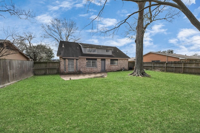 back of property featuring a patio and a lawn