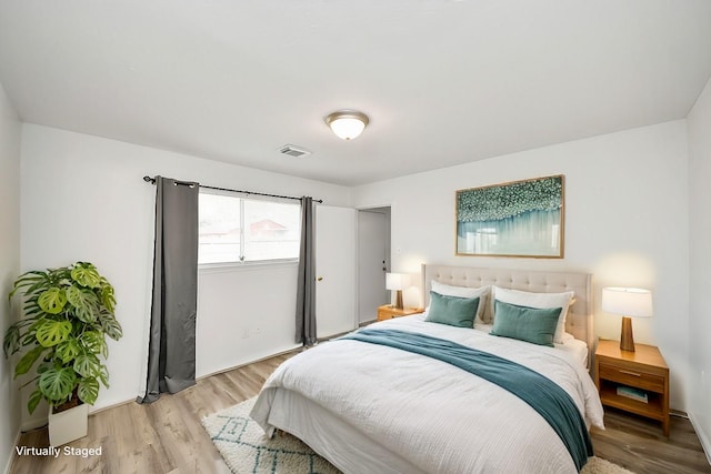 bedroom with light hardwood / wood-style floors