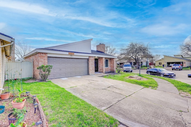 view of front facade with a garage and a front yard