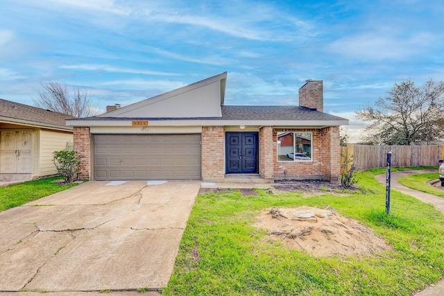 ranch-style home featuring a garage and a front yard