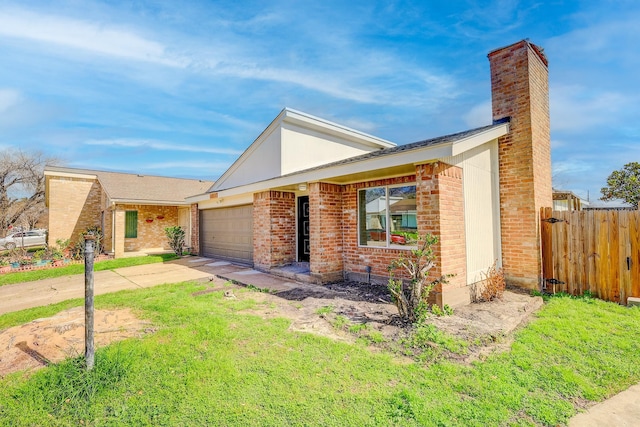 single story home featuring a garage and a front yard