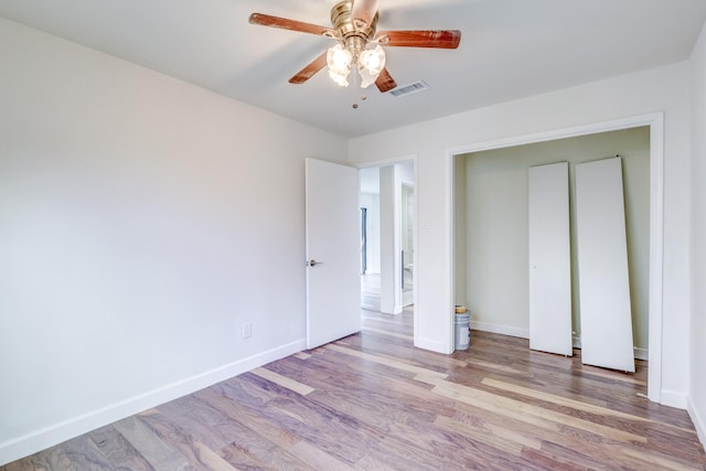 unfurnished bedroom featuring ceiling fan and light hardwood / wood-style flooring