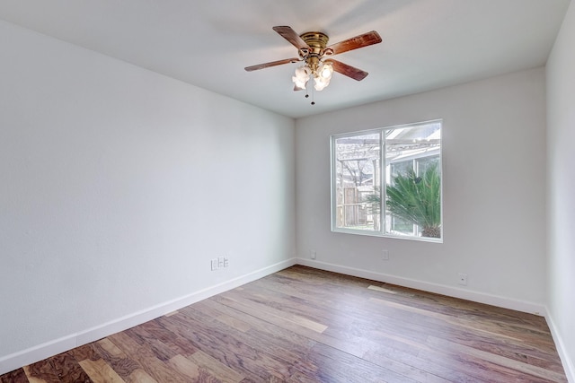 spare room featuring ceiling fan and light hardwood / wood-style flooring