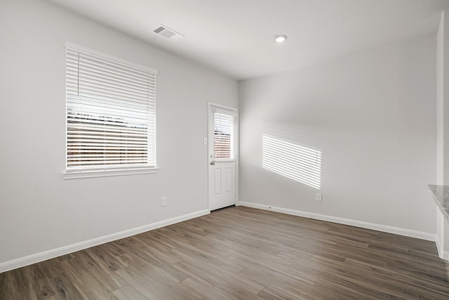 unfurnished room featuring wood-type flooring