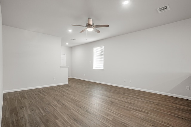 unfurnished room featuring dark hardwood / wood-style floors and ceiling fan