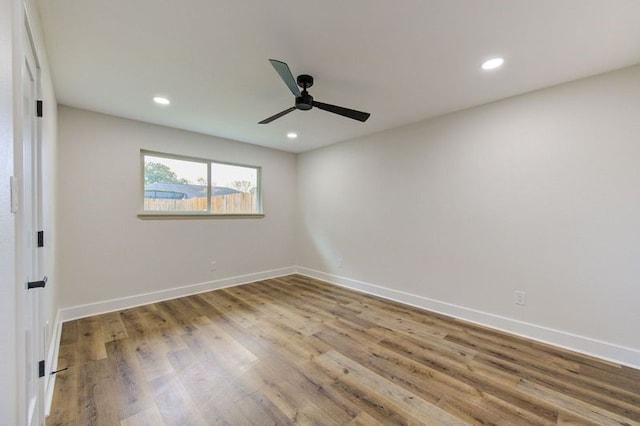 14142 Rosetta Dr, Cypress, TX 77429 - empty room with ceiling fan, wood finished floors, baseboards, and recessed lighting