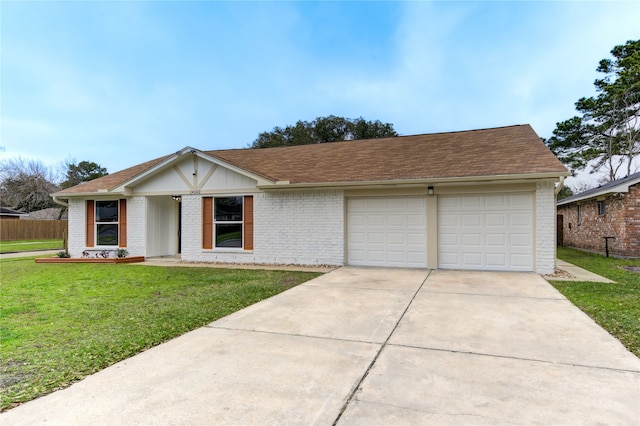 view of front of property with a front yard, concrete driveway, and brick siding