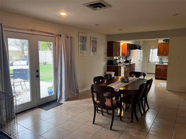 tiled dining space with french doors