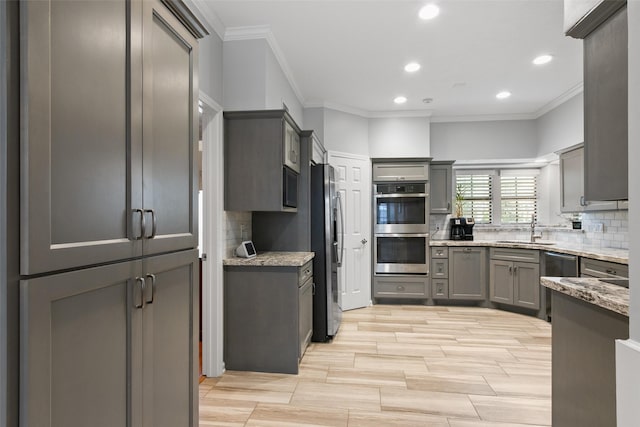 7315 Muirfield Valley Dr, Houston, TX 77095 - kitchen featuring a sink, appliances with stainless steel finishes, crown molding, and gray cabinets