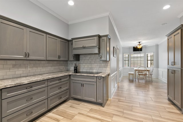7315 Muirfield Valley Dr, Houston, TX 77095 - kitchen with gray cabinets, a ceiling fan, tasteful backsplash, ornamental molding, and a decorative wall