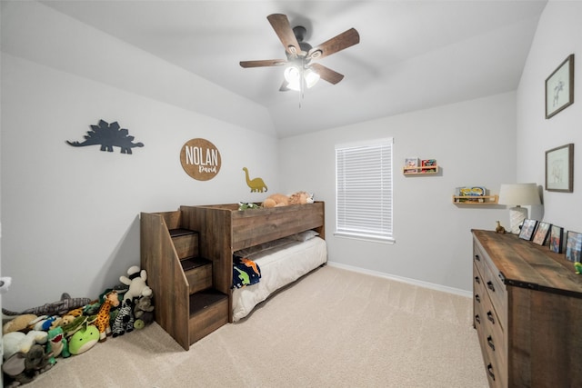 bedroom with lofted ceiling, light colored carpet, and ceiling fan