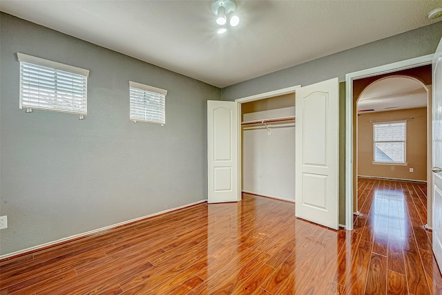 403 Crosby Village Dr, Crosby, TX 77532 - unfurnished bedroom featuring wood-type flooring and a closet