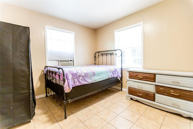 bedroom featuring light tile patterned floors