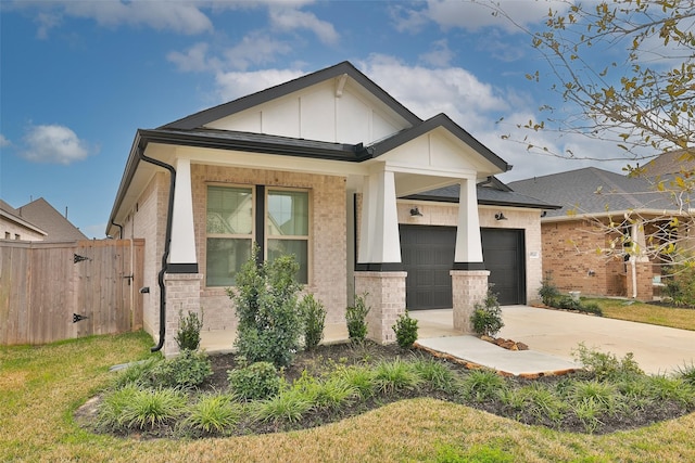 view of front of property with board and batten siding, a garage, concrete driveway, and brick siding