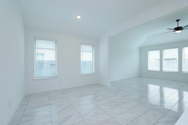 unfurnished room with lofted ceiling, a ceiling fan, and recessed lighting