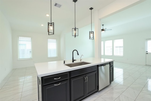 kitchen featuring light countertops, open floor plan, a kitchen island with sink, a sink, and dishwasher