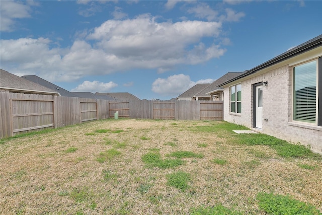 view of yard with a fenced backyard