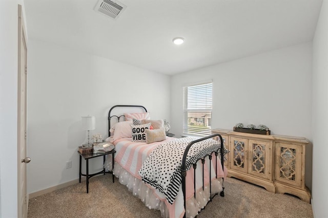 bedroom featuring light colored carpet