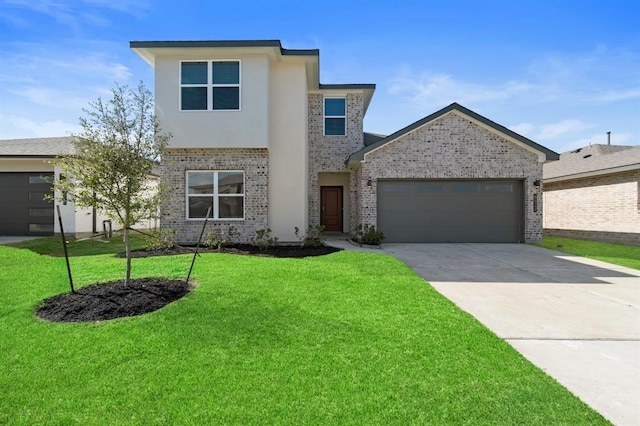 view of front of house featuring a garage and a front yard